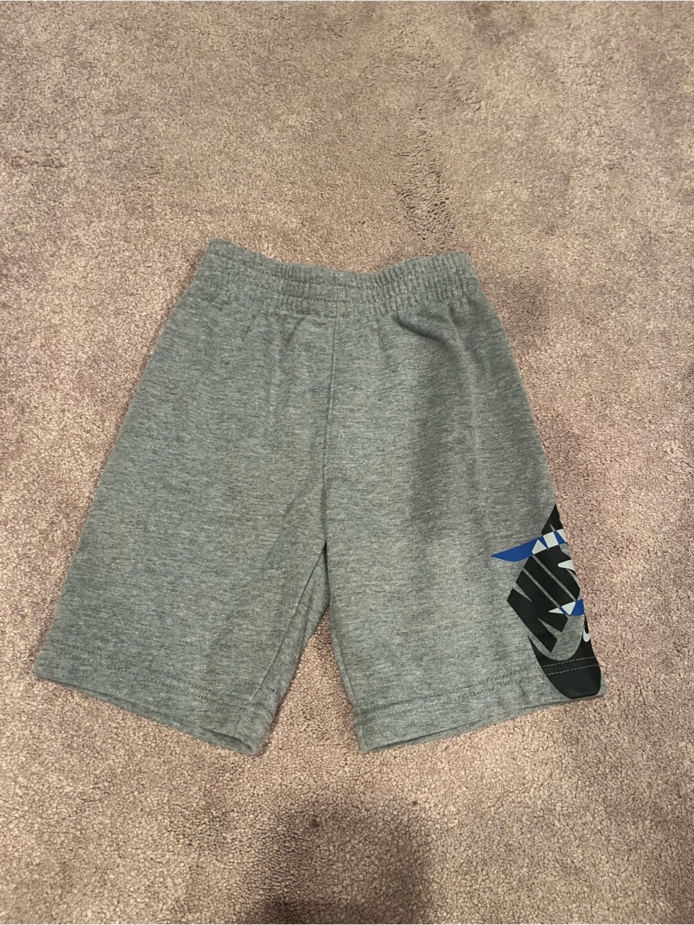 Nike Gray Kids Athletic Shorts with Blue Accent Graphic